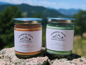 All of our soy wax candles are homemade using the finest all natural ingredients. These two candles are posing in the Rocky Mountains, just outside of Denver, Colorado, to show how much we care about preserving our local Colorado landscape.